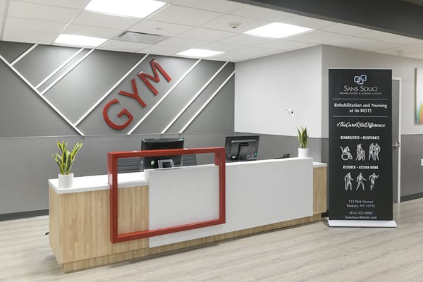Interior view of a gym area with reception desk
