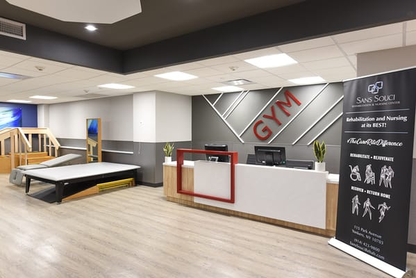 Interior view of a gym with equipment and reception