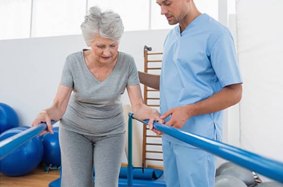 A senior woman participating in a physical therapy session