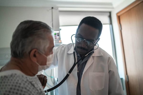 Doctor examining a patient in a medical room