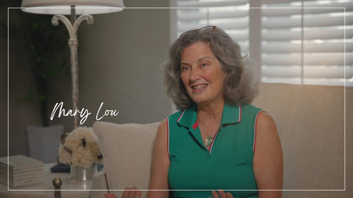 Smiling resident sharing her experiences in a comfortable setting