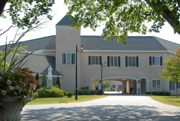 Exterior view of a senior living facility with landscaping