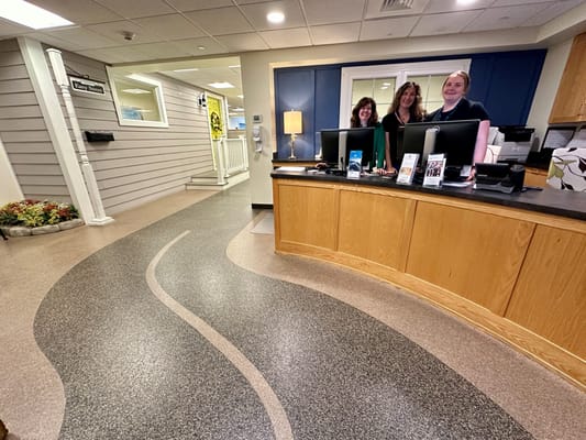 Reception area with staff at the front desk