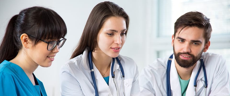 Medical staff collaborating in a bright setting
