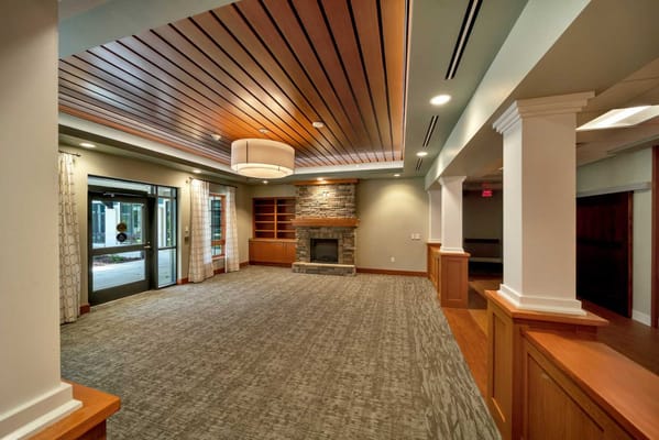 Interior view of a common area with seating and fireplace
