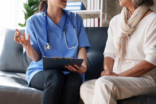 Healthcare professional consulting with a senior resident