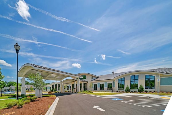 Front entrance view of a modern assisted living facility