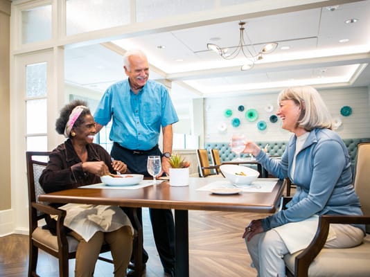 Residents enjoying a meal in a dining area