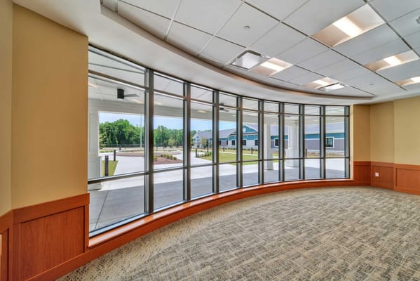 Interior lobby with large windows overlooking the entrance