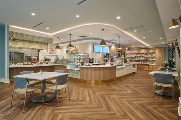 Bright dining area with modern furnishings and food display