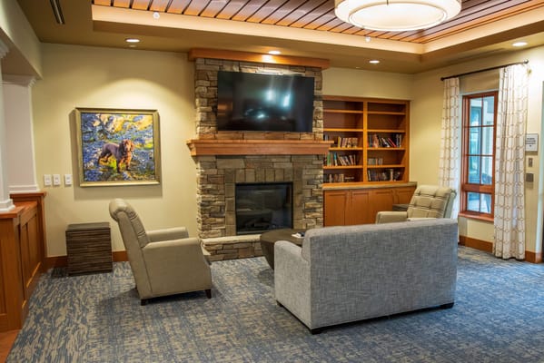 Cozy common area with seating and a fireplace