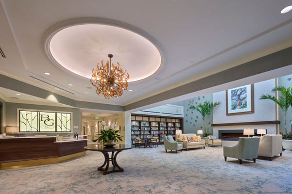 Bright and welcoming lobby area with seating and bookshelves