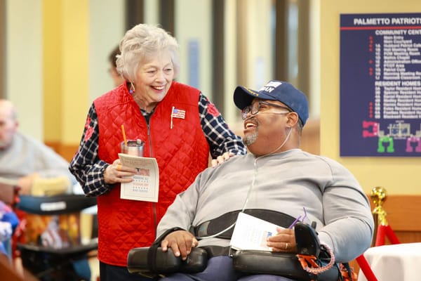 Residents enjoying a cheerful conversation in the common area