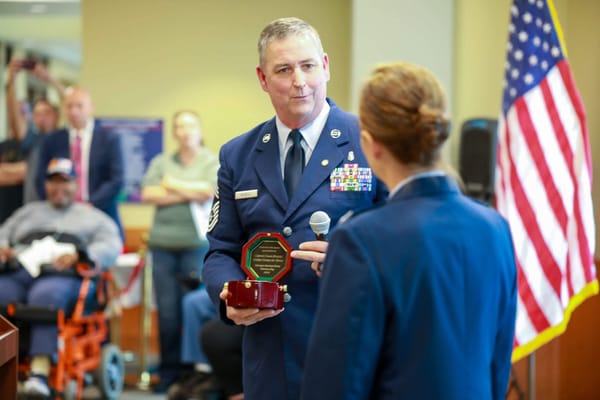 Ceremony honoring a veteran in a common area