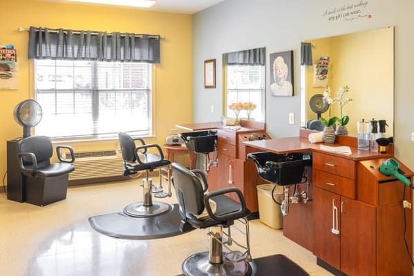 Well-equipped beauty salon with styling chairs and mirrors