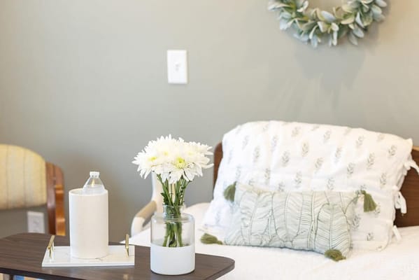 Cozy private resident room with floral decor