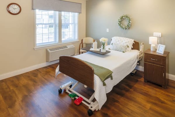 Cozy bedroom with a hospital bed and decor