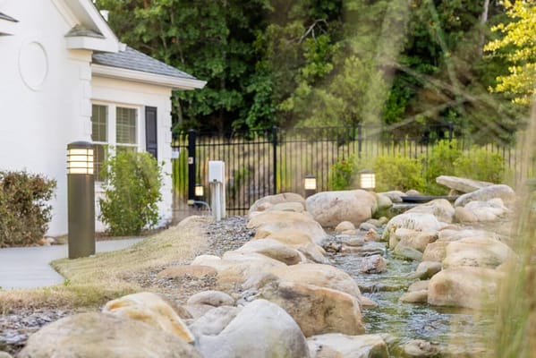 Beautiful outdoor landscape with stones and lighting