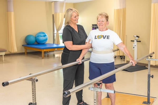 Physical therapy session with a resident and staff