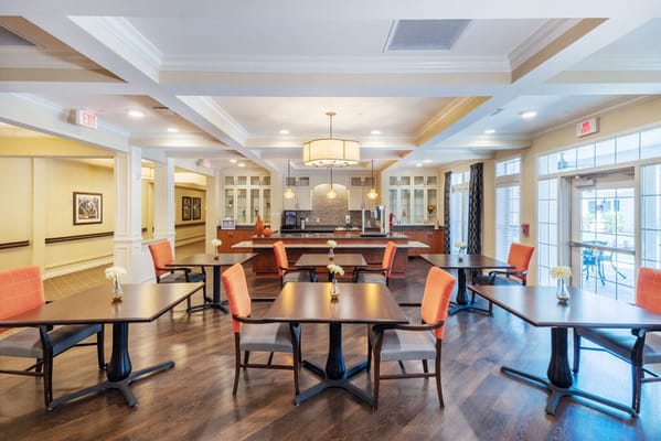 Bright dining room with tables and chairs
