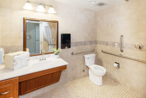 Accessible bathroom equipped with grab bars and amenities
