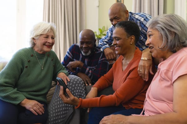 Residents enjoying a group activity in a cozy common area