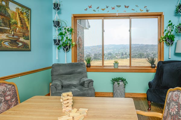 Bright common area with seating and plants