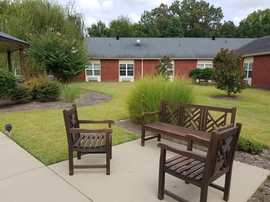 Outdoor seating area with benches in a garden