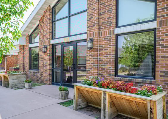 Exterior view of assisted living facility with flower planters