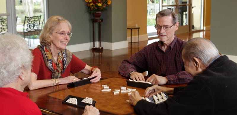 Residents enjoying a game in a common area