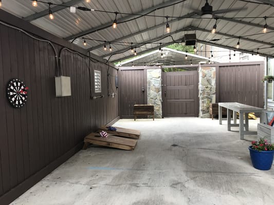 Outdoor patio area with seating and lighting