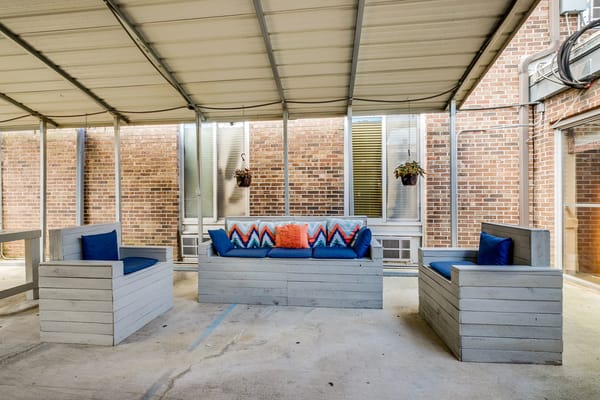 Outdoor seating area with colorful cushions