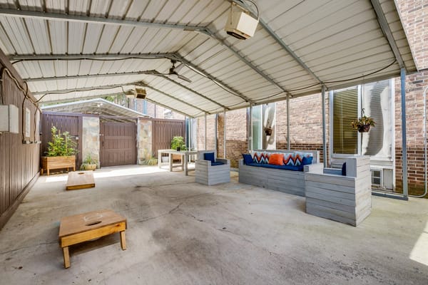 Covered outdoor seating area with comfortable furniture