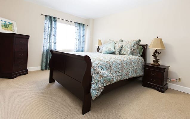 Comfortable private bedroom in a senior living facility