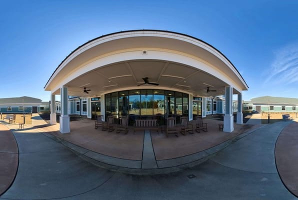 Exterior view of the facility with outdoor seating area