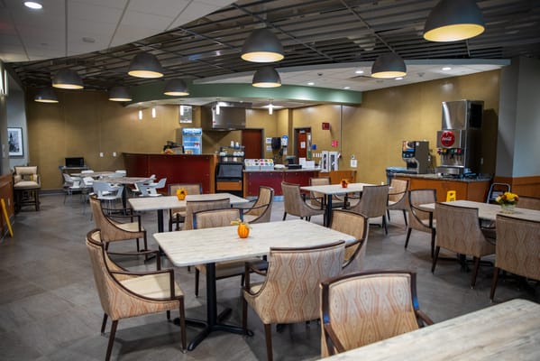 Interior view of a dining area with tables and chairs