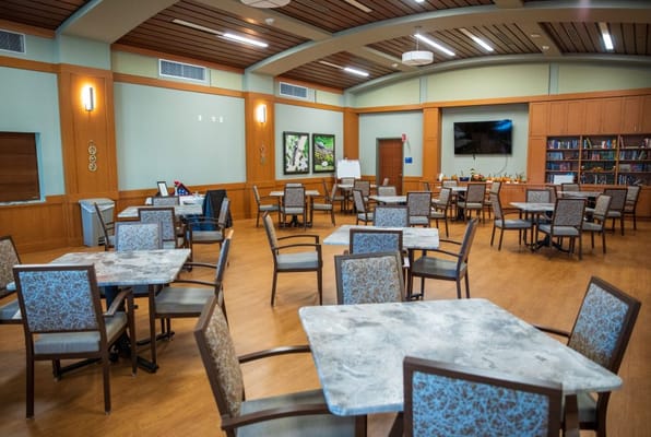 Bright common area with tables and chairs