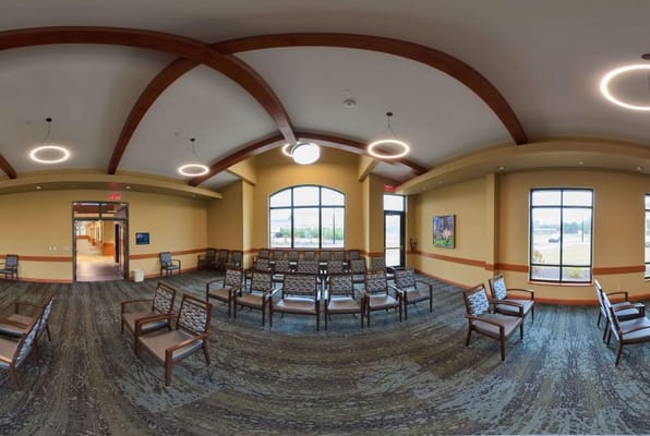 Interior view of a bright common area with seating