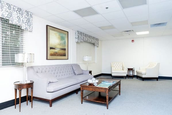 Bright common area with seating and artwork