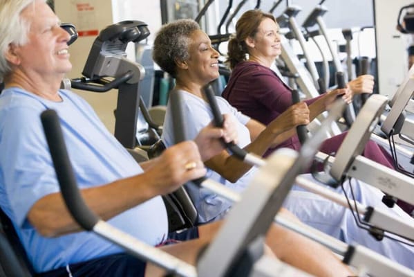 Residents participating in a fitness activity in a gym