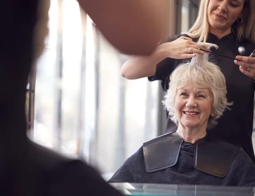 Senior enjoying a haircut at a salon