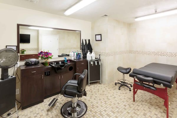 Salon area in a senior living facility with styling chairs and mirrors
