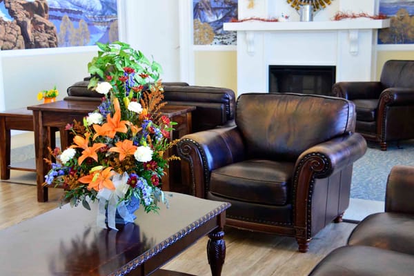 Cozy interior common area with floral arrangement