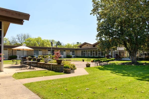 Outdoor area with seating and greenery