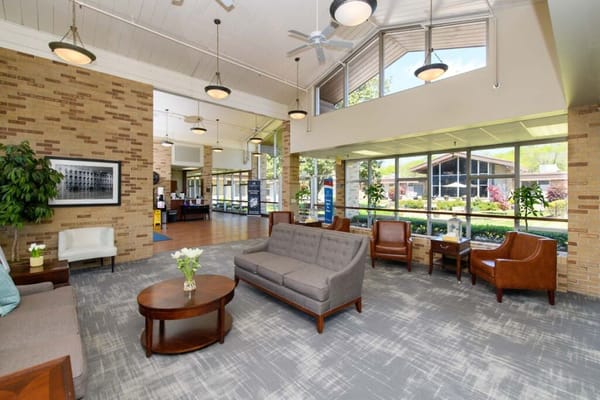 Bright lobby area with comfortable seating and large windows