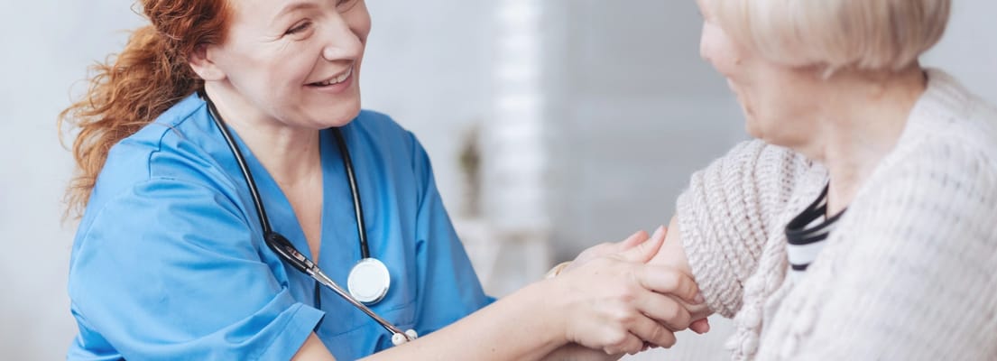 Nurse interacting warmly with a resident