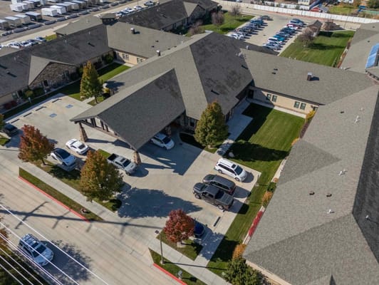 Aerial view of a senior living facility with parking