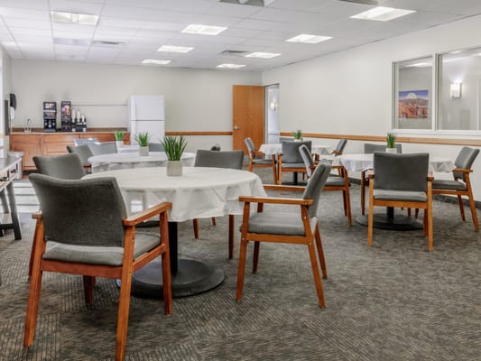 Bright dining room with tables and chairs