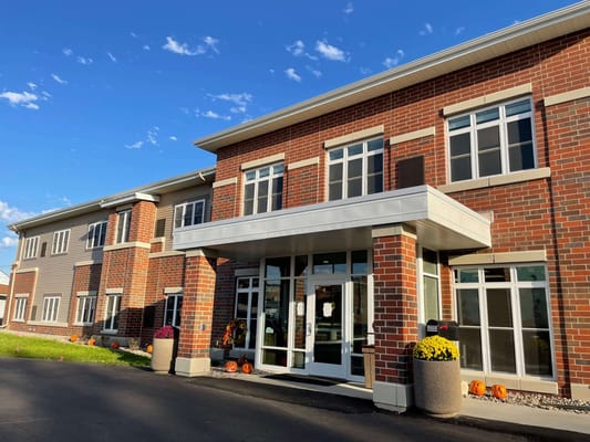 Exterior view of a senior living facility with seasonal decorations