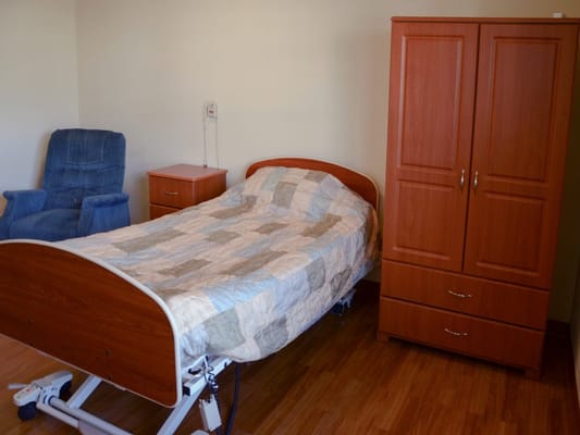 Private bedroom with bed and wardrobe